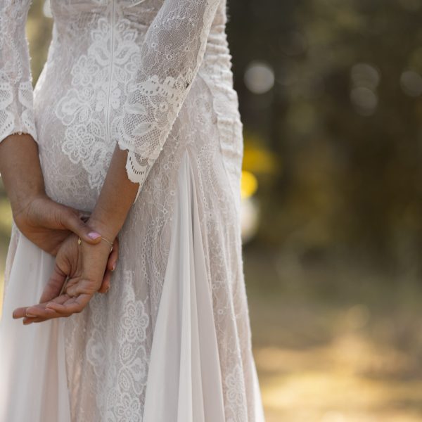 side-view-beautiful-bride-posing-outdoors